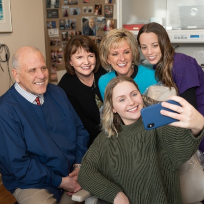 Tacoma dentist team selfie with his patient at Soundview Dental Arts